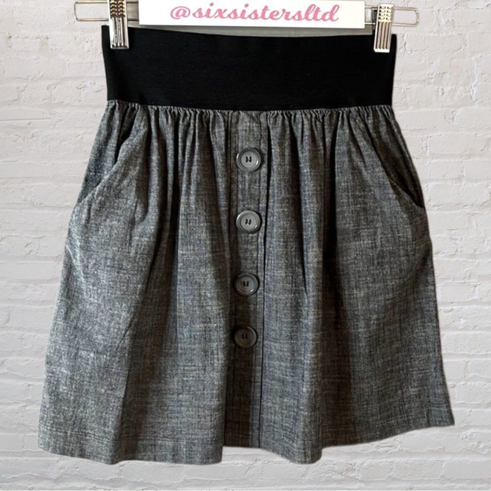 Love Culture wide elastic waistband miniskirt w/ 2 front pockets & faux buttons.